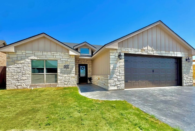 3634 Silver Spur Dr, San Angelo, TX 76904 - ranch-style home with stone siding, board and batten siding, a front yard, an attached garage, and driveway