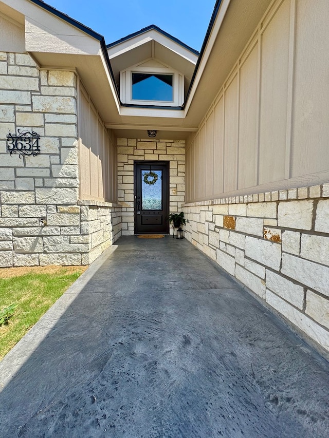 3634 Silver Spur Dr, San Angelo, TX 76904 - doorway to property with board and batten siding and stone siding