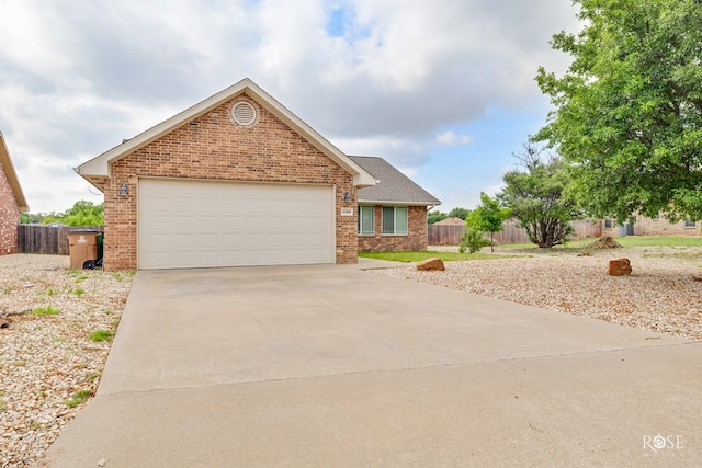 4506 Oak Grove Blvd, San Angelo, TX 76904 - ranch-style house featuring brick siding, driveway, fence, and a garage