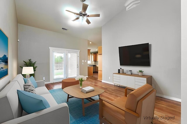 4506 Oak Grove Blvd, San Angelo, TX 76904 - living room with baseboards, a ceiling fan, light wood finished floors, and visible vents