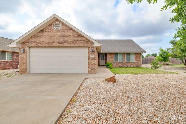 4506 Oak Grove Blvd, San Angelo, TX 76904 - single story home featuring brick siding, a garage, fence, and driveway