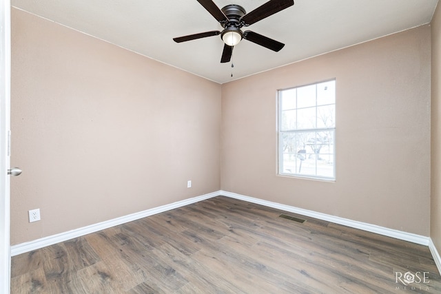 1611 Mission Ave, San Angelo, TX 76905 - empty room featuring a ceiling fan and wood finished floors
