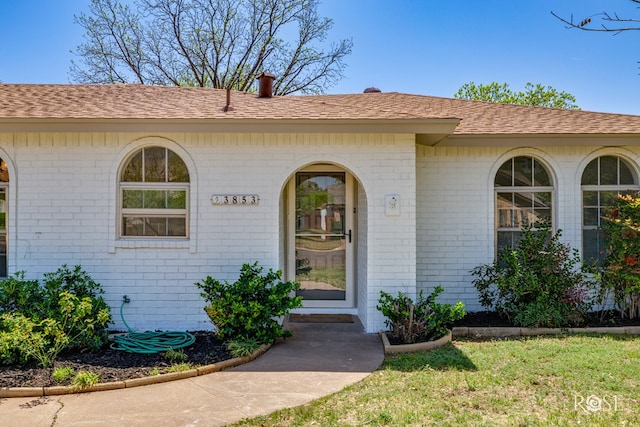 3853 Sandstone Rd, San Angelo, TX 76904 - property entrance with brick siding and a shingled roof