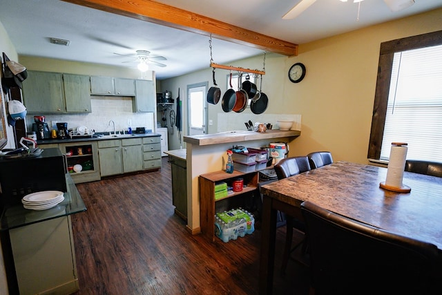 7229 Sun Ln, San Angelo, TX 76901 - kitchen featuring a ceiling fan, dark wood finished floors, backsplash, a sink, and beam ceiling