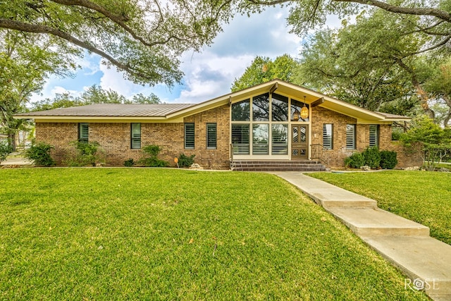 ranch-style house with a front lawn