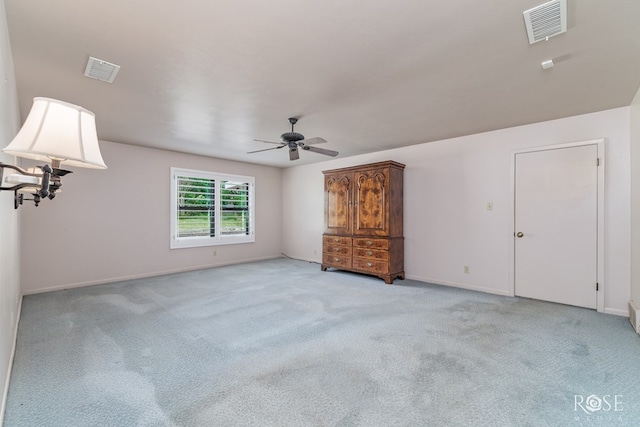 carpeted empty room with ceiling fan