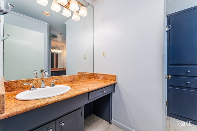 bathroom with vanity, tile patterned flooring, and ornamental molding