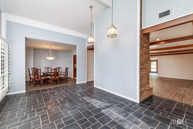 interior space with vaulted ceiling with beams