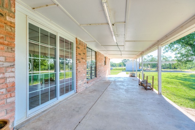 view of patio with a storage unit