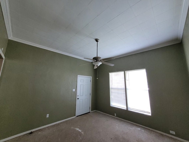 carpeted empty room with crown molding and ceiling fan