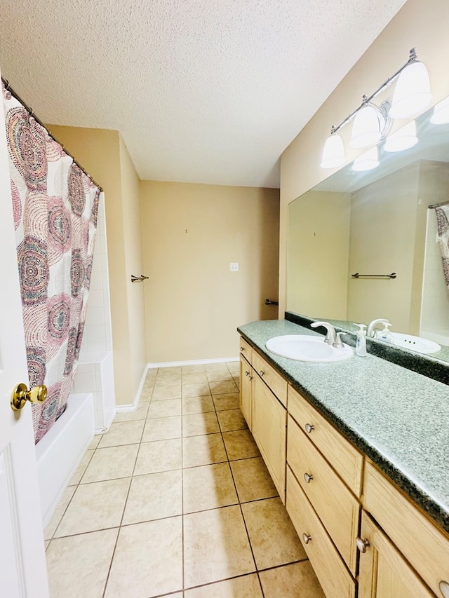 bathroom with tile patterned floors, shower / tub combo, vanity, and a textured ceiling