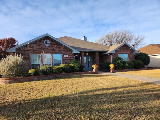 ranch-style house featuring a front lawn