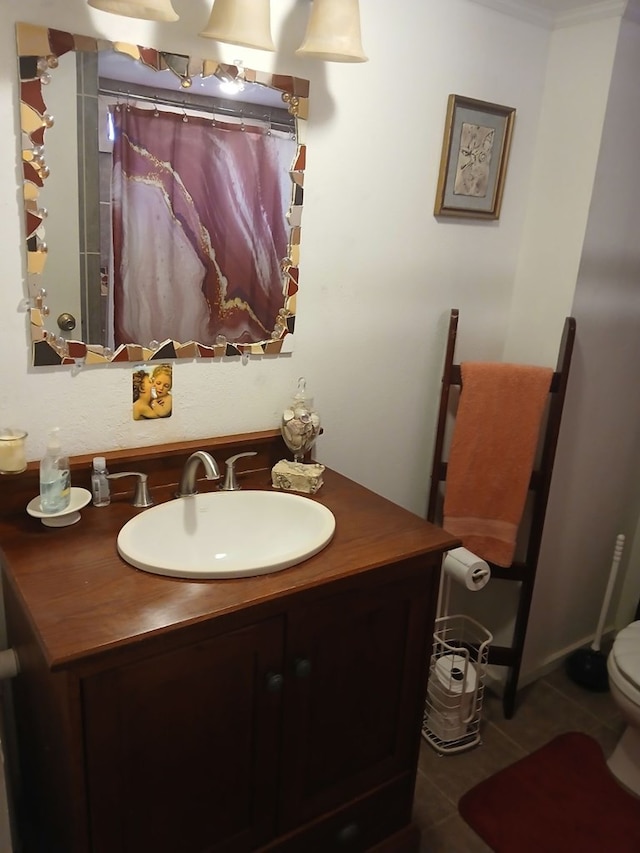 bathroom featuring toilet, ornamental molding, curtained shower, tile patterned floors, and vanity
