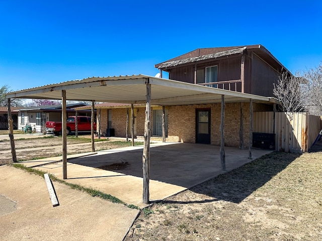 1009 E 6th St, Big Lake, TX 76932 - back of property with a carport and brick siding