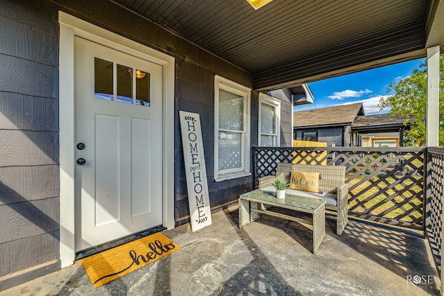 doorway to property with a porch