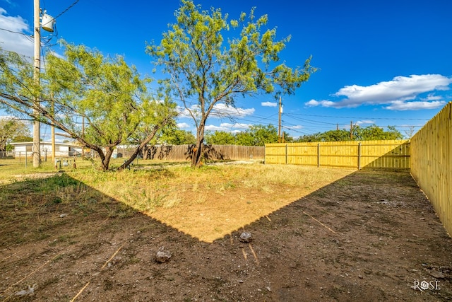 view of yard with a fenced backyard
