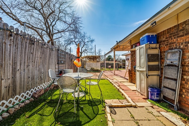 view of yard with a fenced backyard and a patio