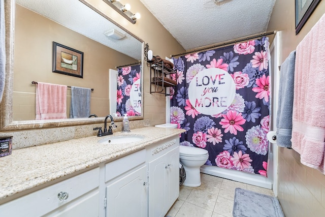 bathroom with visible vents, toilet, a textured ceiling, vanity, and tile patterned floors