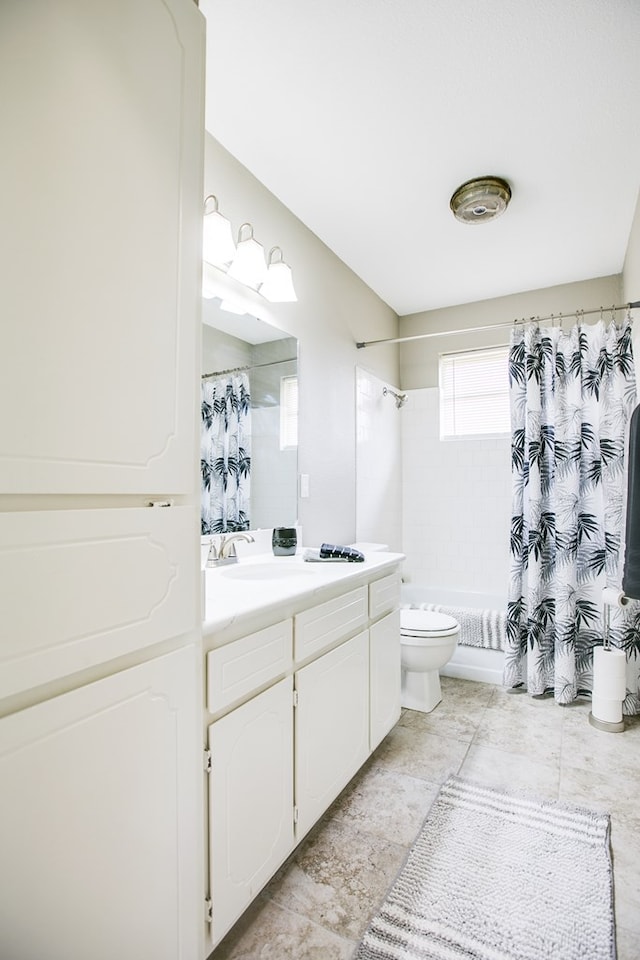 3306 Timber Ridge Dr, San Angelo, TX 76904 - bathroom with vanity and shower / bath combo with shower curtain