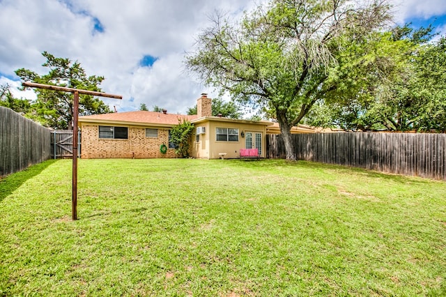 3306 Timber Ridge Dr, San Angelo, TX 76904 - fenced backyard with french doors