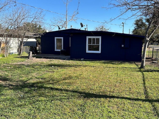 view of property exterior with a lawn