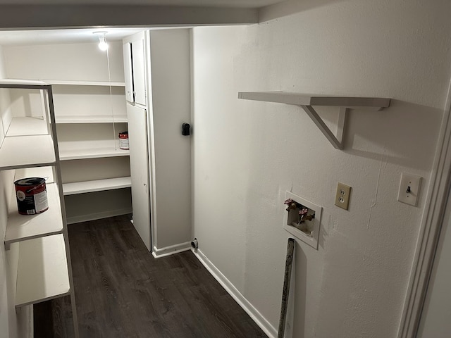 laundry room featuring dark wood-type flooring and hookup for a washing machine