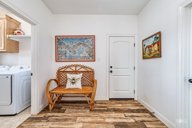 5292 Grey Wolf Ln, San Angelo, TX 76901 - washroom featuring cabinet space, washing machine and dryer, light wood finished floors, and baseboards
