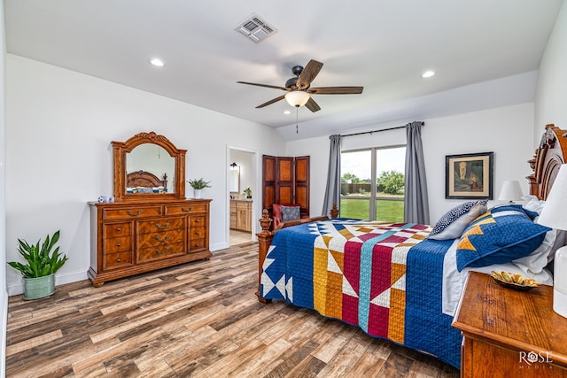 5292 Grey Wolf Ln, San Angelo, TX 76901 - bedroom featuring wood finished floors, recessed lighting, ensuite bathroom, ceiling fan, and baseboards