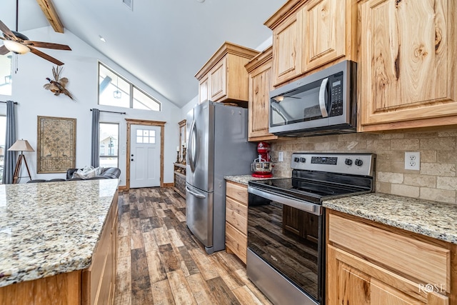 5292 Grey Wolf Ln, San Angelo, TX 76901 - kitchen with appliances with stainless steel finishes, dark wood-style flooring, tasteful backsplash, beam ceiling, and open floor plan