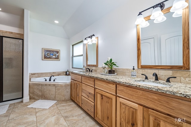5292 Grey Wolf Ln, San Angelo, TX 76901 - full bath featuring double vanity, a garden tub, a stall shower, and vaulted ceiling