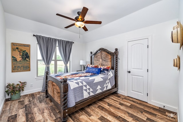 5292 Grey Wolf Ln, San Angelo, TX 76901 - bedroom with dark wood-style flooring, baseboards, and a ceiling fan