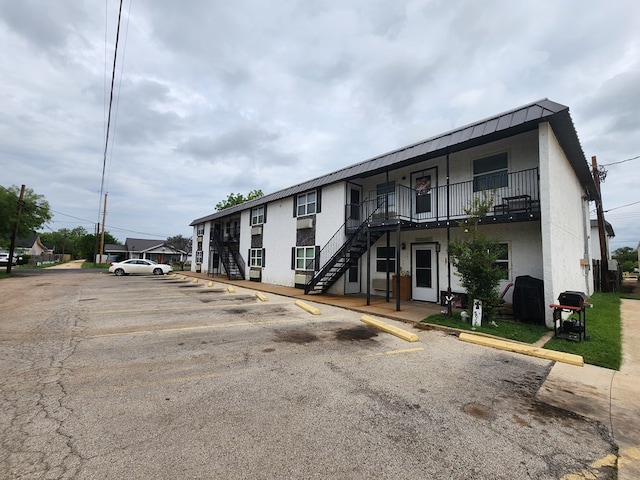 1901 Pulliam St, San Angelo, TX 76905 - view of building exterior featuring stairs and uncovered parking