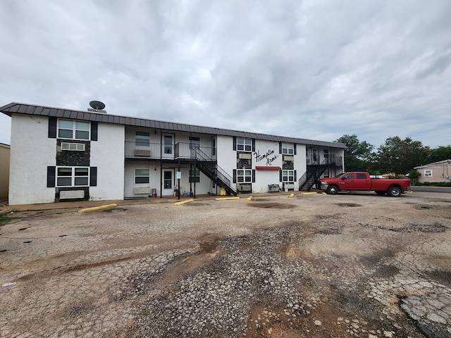 1901 Pulliam St, San Angelo, TX 76905 - view of property featuring stairs and uncovered parking