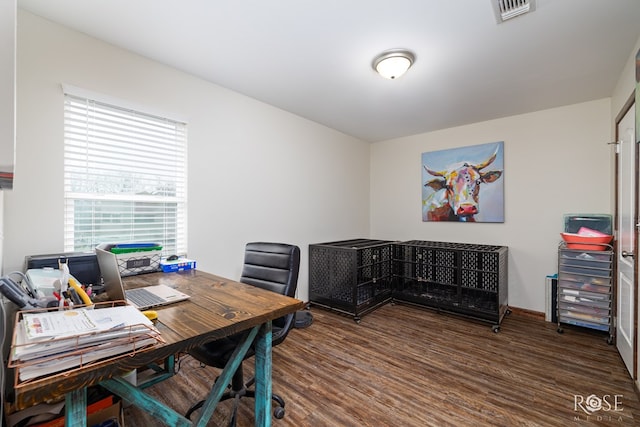 home office with visible vents and wood finished floors