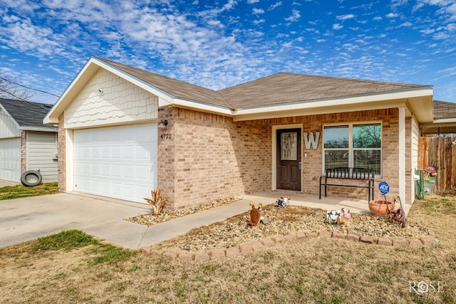 ranch-style home with a garage, covered porch, brick siding, fence, and driveway