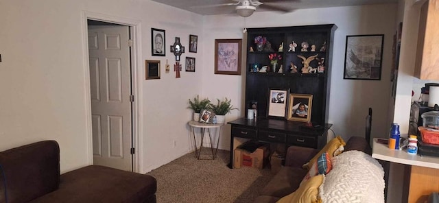 interior space with ceiling fan and carpet