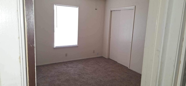 unfurnished bedroom with carpet