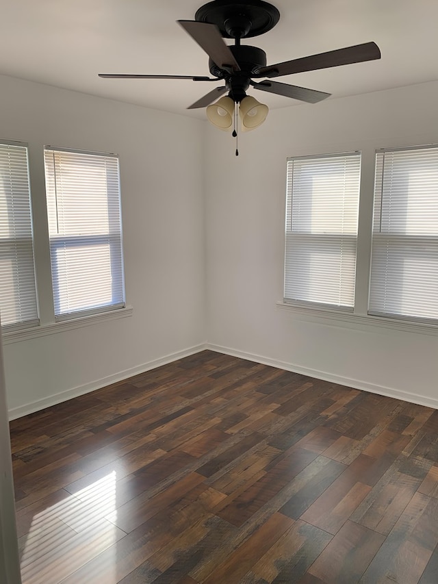 62 E 39th St, San Angelo, TX 76903 - empty room with ceiling fan, dark wood-style floors, and baseboards