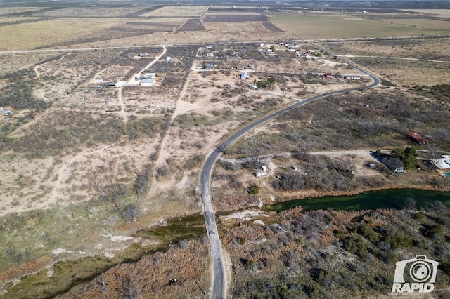 birds eye view of property featuring a rural view