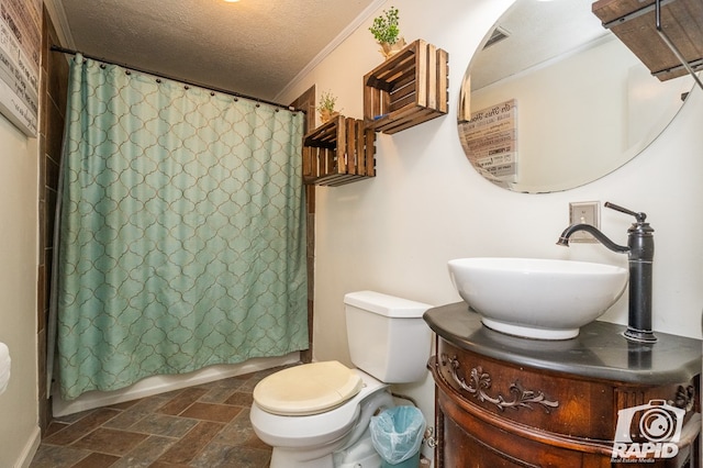 full bathroom featuring toilet, crown molding, a textured ceiling, vanity, and shower / bath combo