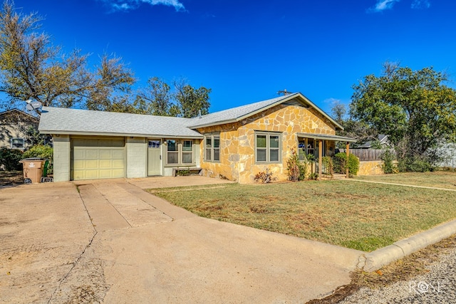 ranch-style house with a garage and a front yard