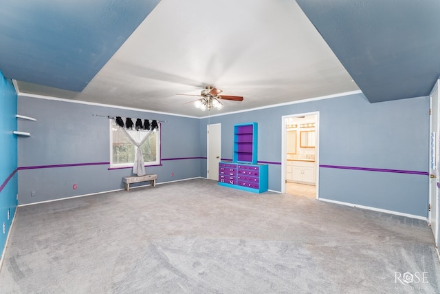 3237 Red Bluff Rd W, San Angelo, TX 76904 - spare room with ceiling fan, carpet flooring, baseboards, and ornamental molding