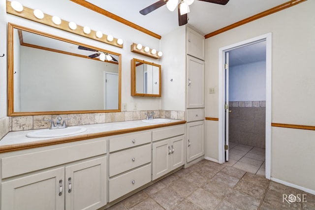 3237 Red Bluff Rd W, San Angelo, TX 76904 - bathroom featuring ceiling fan, double vanity, and crown molding
