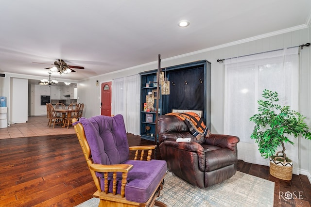 3237 Red Bluff Rd W, San Angelo, TX 76904 - living room featuring wood-type flooring, crown molding, a chandelier, ceiling fan, and recessed lighting