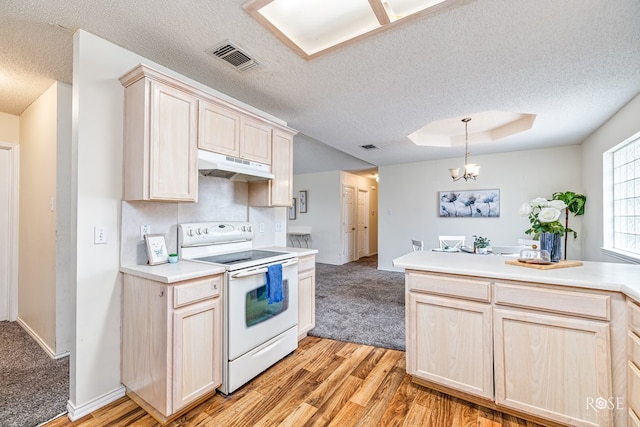 5221 Coral Way, San Angelo, TX 76904 - kitchen featuring electric range, light brown cabinets, a textured ceiling, under cabinet range hood, and light wood-style floors