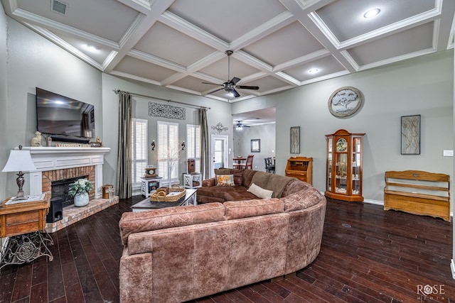 3122 Clearview Dr, San Angelo, TX 76904 - living room featuring ceiling fan, wood-type flooring, coffered ceiling, a fireplace, and beam ceiling