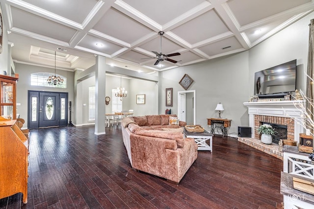 3122 Clearview Dr, San Angelo, TX 76904 - living room with a chandelier, coffered ceiling, hardwood / wood-style flooring, a ceiling fan, and a brick fireplace