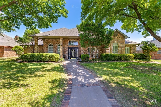 3122 Clearview Dr, San Angelo, TX 76904 - view of front of home with a front lawn and brick siding