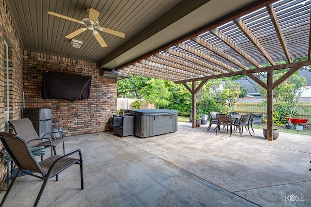 3122 Clearview Dr, San Angelo, TX 76904 - fenced backyard featuring a hot tub, outdoor dining area, a patio, ceiling fan, and a pergola