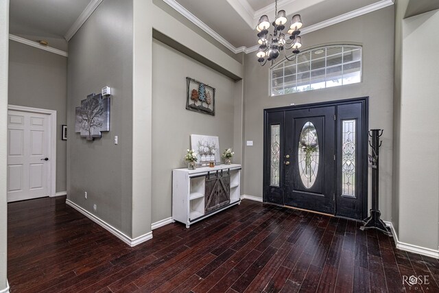 3122 Clearview Dr, San Angelo, TX 76904 - entryway featuring a high ceiling, hardwood / wood-style flooring, a chandelier, and ornamental molding